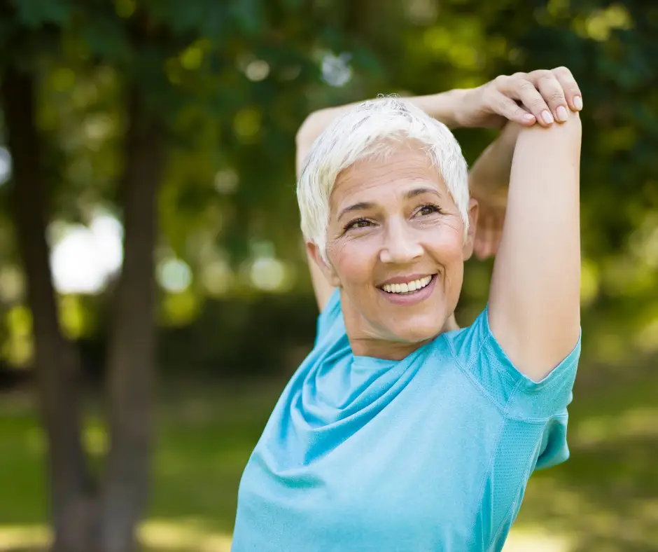 Image of a mature woman stretching, getting ready for a personal training session at Lightwater Leisure Centre