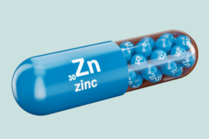 Benefits of Zinc, images of a blue zinc capsule with Zn, Zinc written on the side.