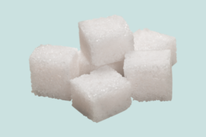 5 Ways Sugar Hijacks Your Brain, Close-up of sugar cubes illustrating the impact of sugar on the brain and addiction